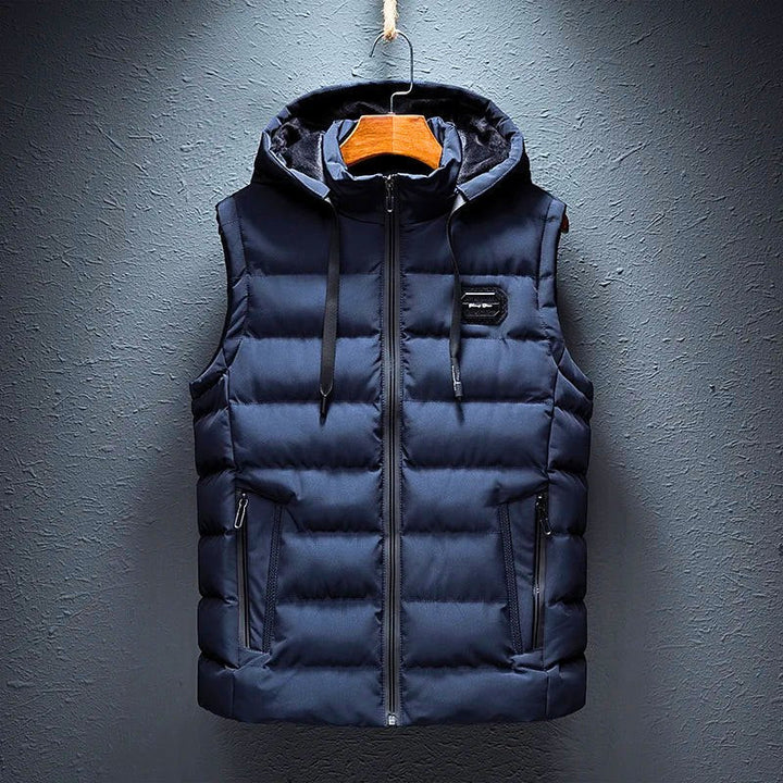 Comfortable men's hooded vest with deep pockets. Padded, lightweight, and warm, ideal for autumn/winter layering.