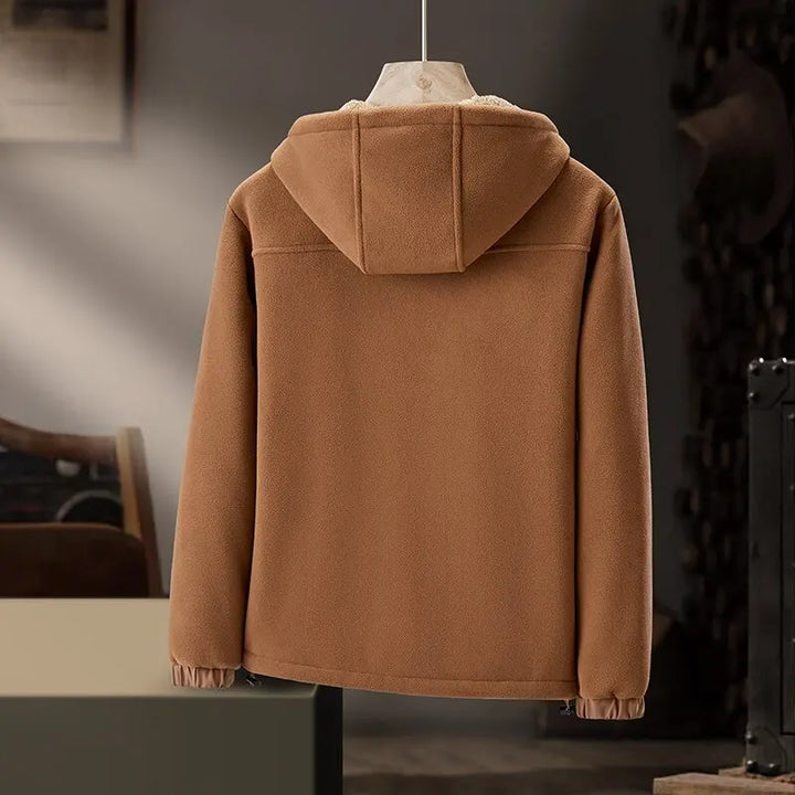 Stylish men's hooded winter jacket with minimalist design and practical zipper pockets.
