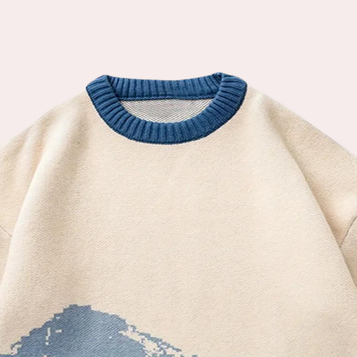 Stylish men's winter sweater showcasing a unique mountain landscape pattern, a cozy and warm knitwear choice.