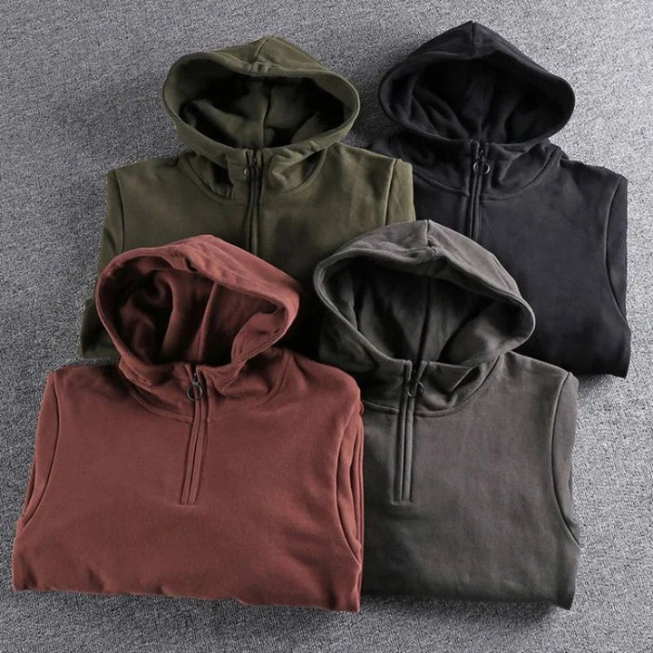 Essential men's cozy quarter-zip hoodie for cool weather, relaxed fit, ideal for everyday comfort.