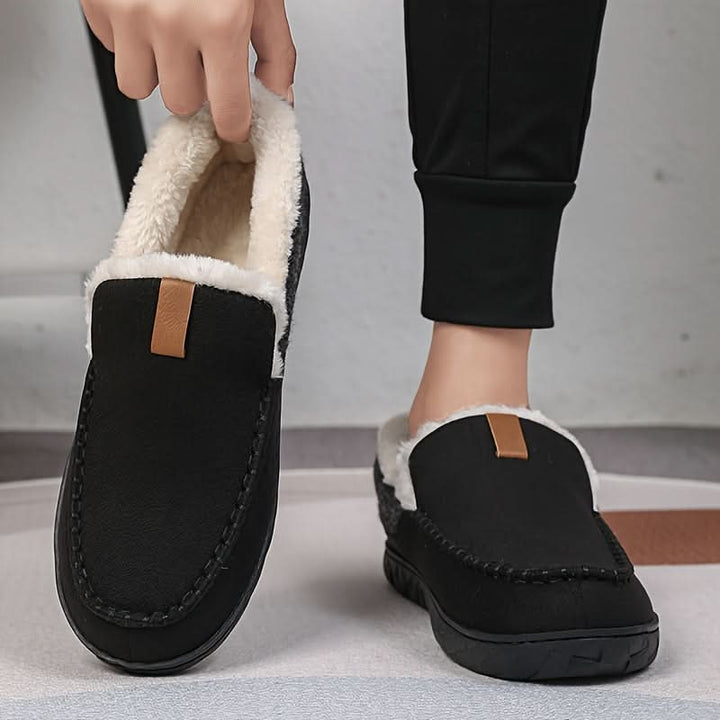 Black men's slip-on cozy slippers, offering warmth, supreme comfort, and style for indoor lounging and fall.