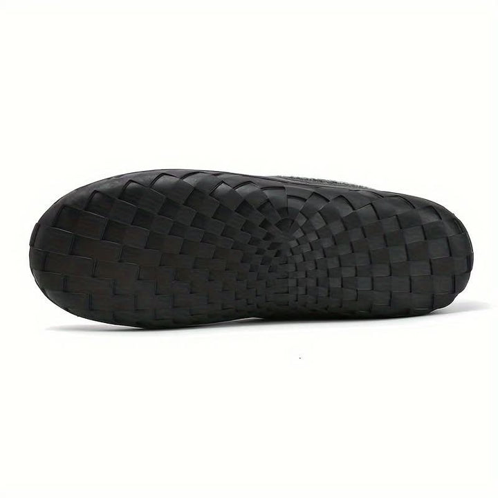 Men's comfortable slip-on house shoes with a durable sole, perfect for indoor and home use, year-round.