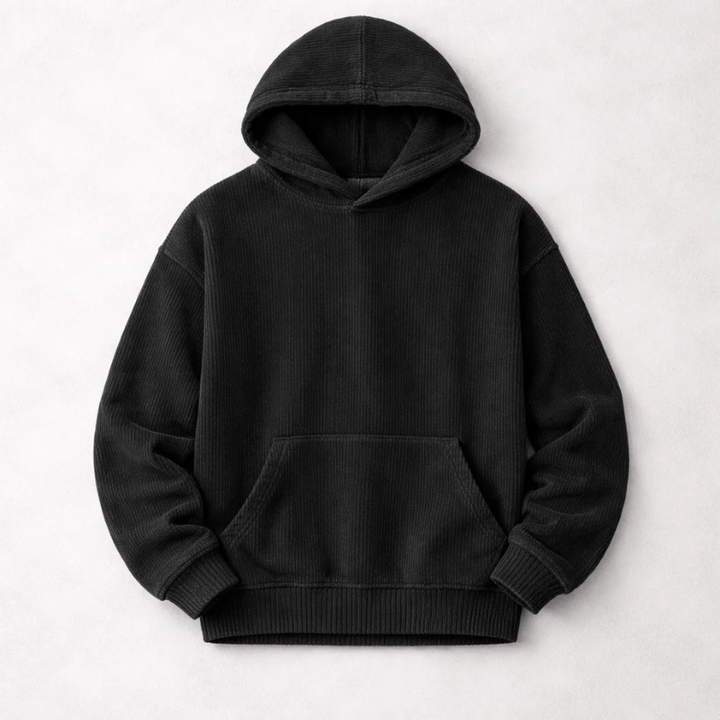 Man wearing a relaxed fit men's cozy winter pullover hoodie, showcasing its comfort and casual everyday style.