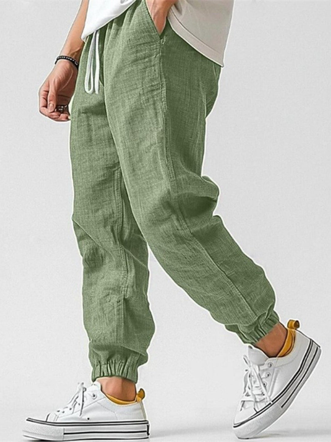 Comfortable men's relaxed fit joggers with cuffed ankles & drawstring, perfect for casual spring wear.