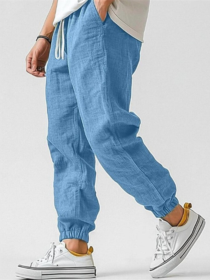 Stylish men's cuffed joggers featuring a relaxed fit & drawstring waist, perfect for everyday effortless style.