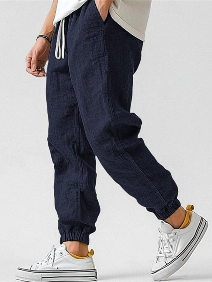 Spring fashion men's track pants. Relaxed fit cuffed joggers with drawstring for ultimate comfort & style.