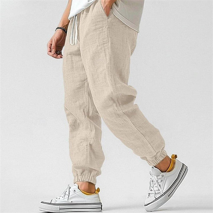 Versatile men's relaxed fit cuffed joggers. Comfortable track pants with drawstring for casual everyday style.