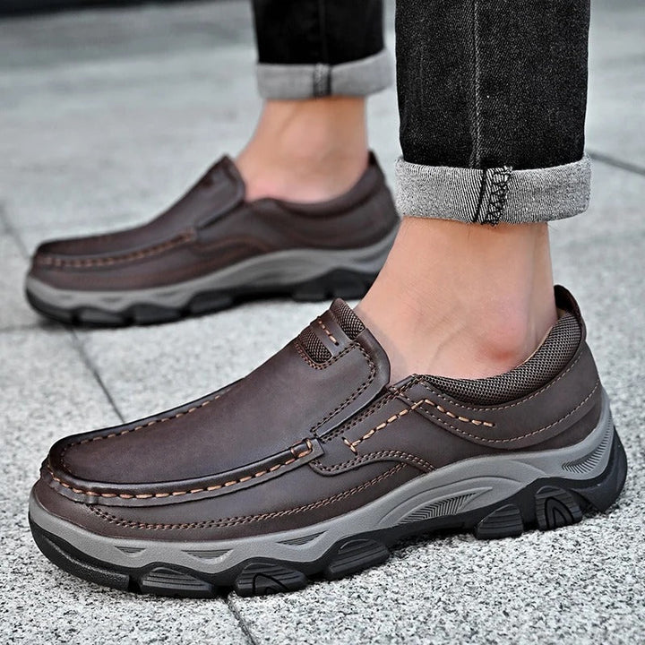 Man wearing durable black Dakota slip-on loafers, perfect for casual outfits & walking.