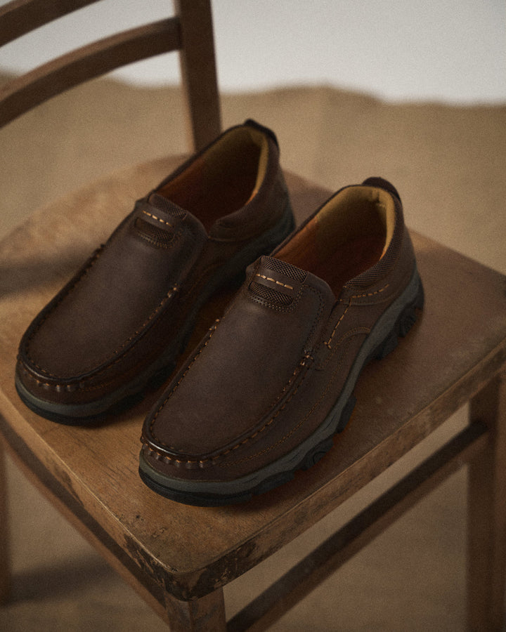 Side view of men's brown Dakota slip-on loafers, showing comfortable, durable design.
