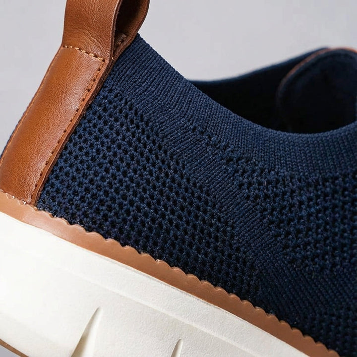 Side profile of men's Damon breathable athletic shoe, blue upper with white sole, great for active wear.