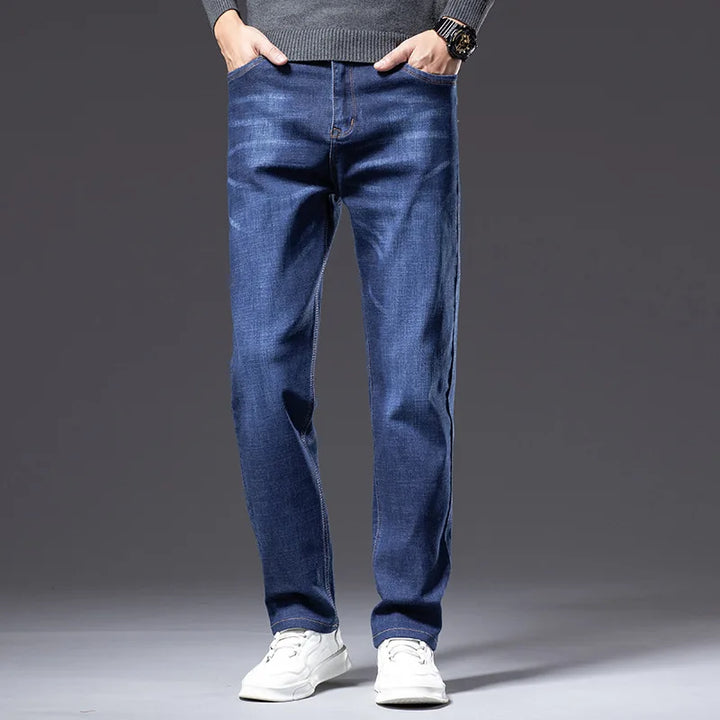 Men's dark blue stretch denim jeans, relaxed fit for comfort & casual style.