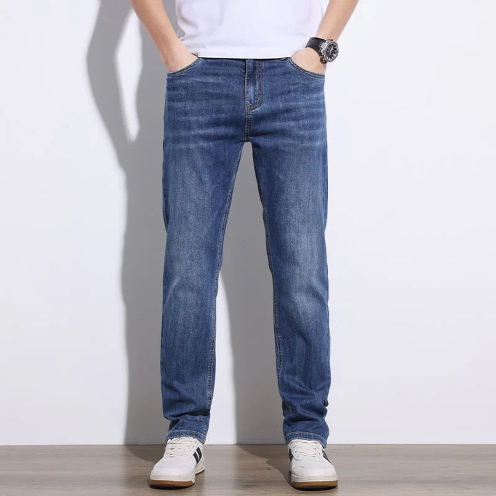 Comfortable men's light blue stretch denim jeans with a relaxed fit for daily wear.