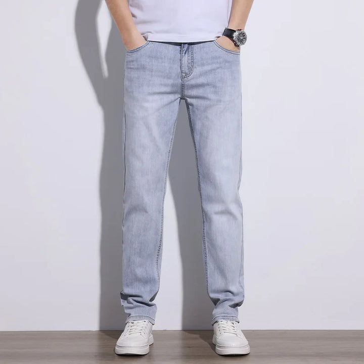 Stylish gray men's stretch denim jeans, offering flexibility and everyday comfort.