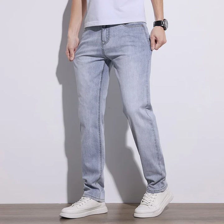Men's stretch denim jeans in a versatile wash, ideal for comfortable everyday wear.