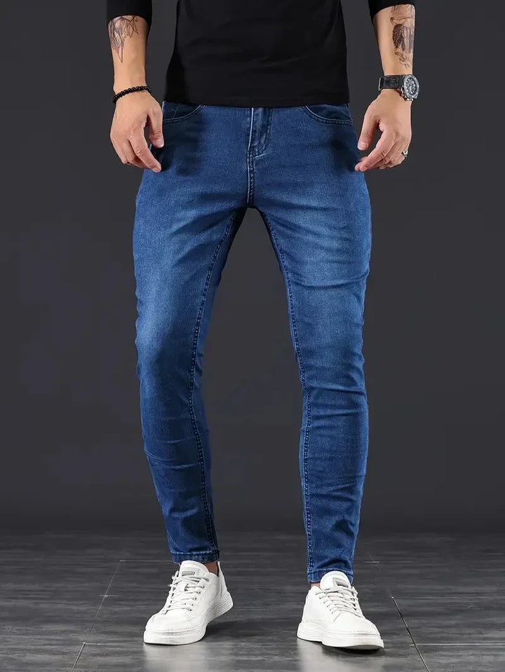 Men's dark wash stretch slim fit jeans, comfortable & modern for everyday wear.