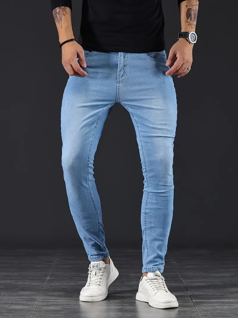 Light wash men's tapered fit stretch jeans, ideal for modern comfort & everyday style.