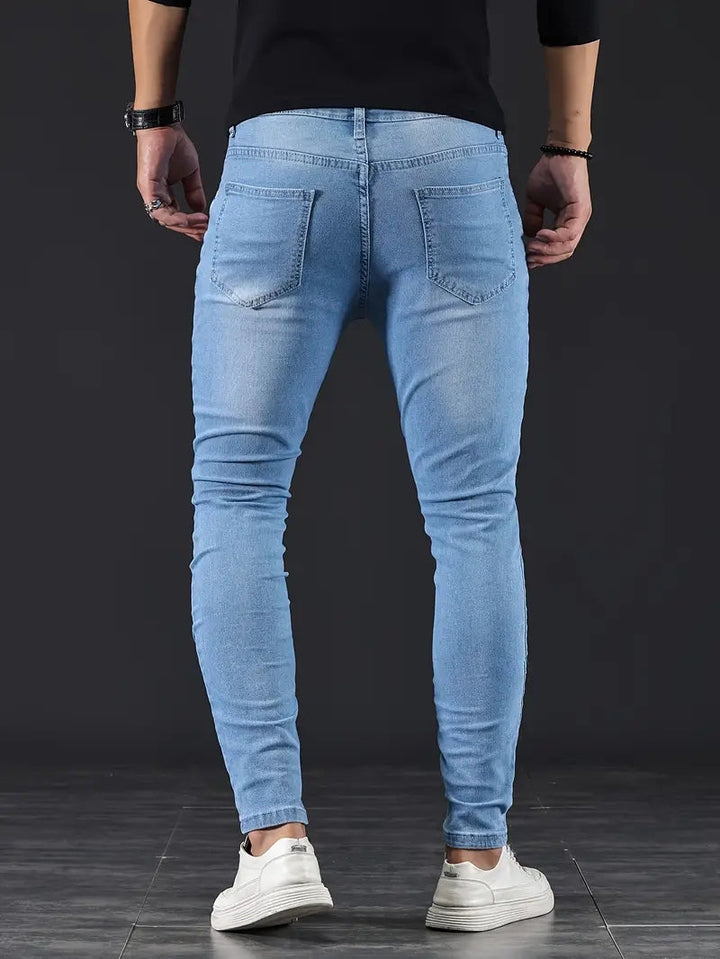 Gray slim fit men's stretch jeans, offering flexible comfort and a modern casual look.