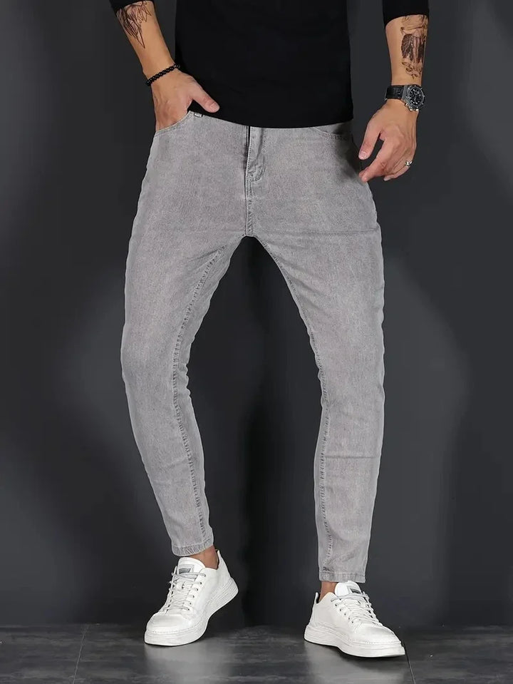 Comfortable men's stretch denim jeans in a slim fit, great for modern everyday fashion.