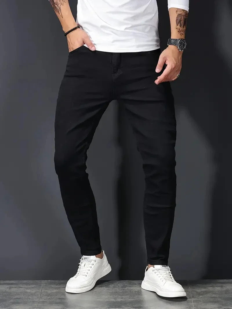 Modern men's dark wash stretch jeans, slim fit for ultimate comfort & flexible wear.