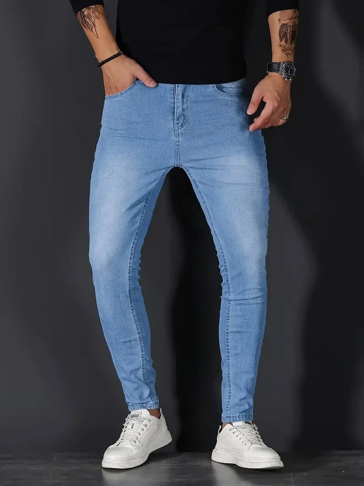 Men's light wash stretch tapered fit jeans, combining modern fashion with ultimate comfort.
