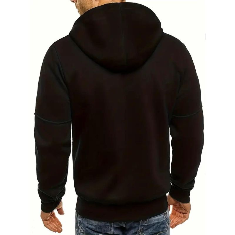 Athletic man in Dexter active vest, demonstrating freedom of movement. Perfect lightweight outerwear for active lifestyles.