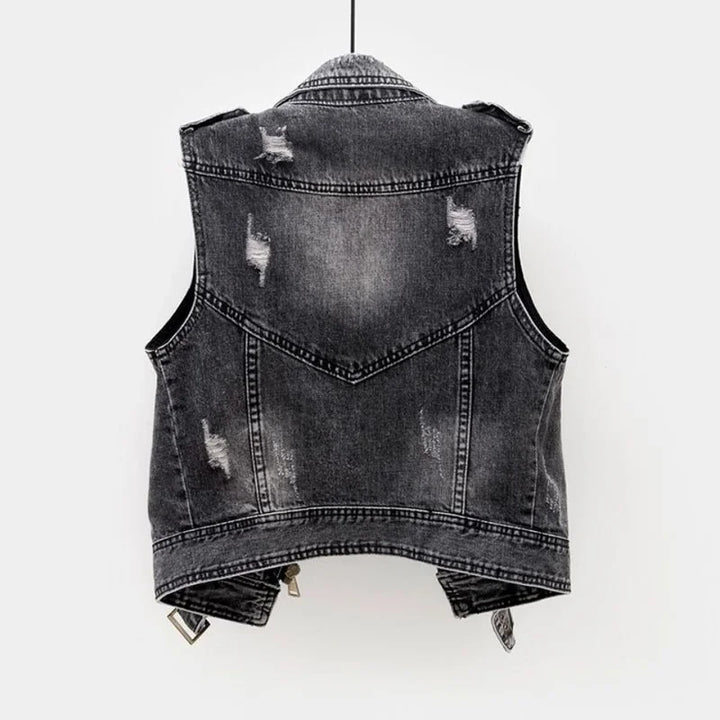 Black distressed denim moto vest for men, a sleeveless jacket with an edgy asymmetric zip for streetwear.