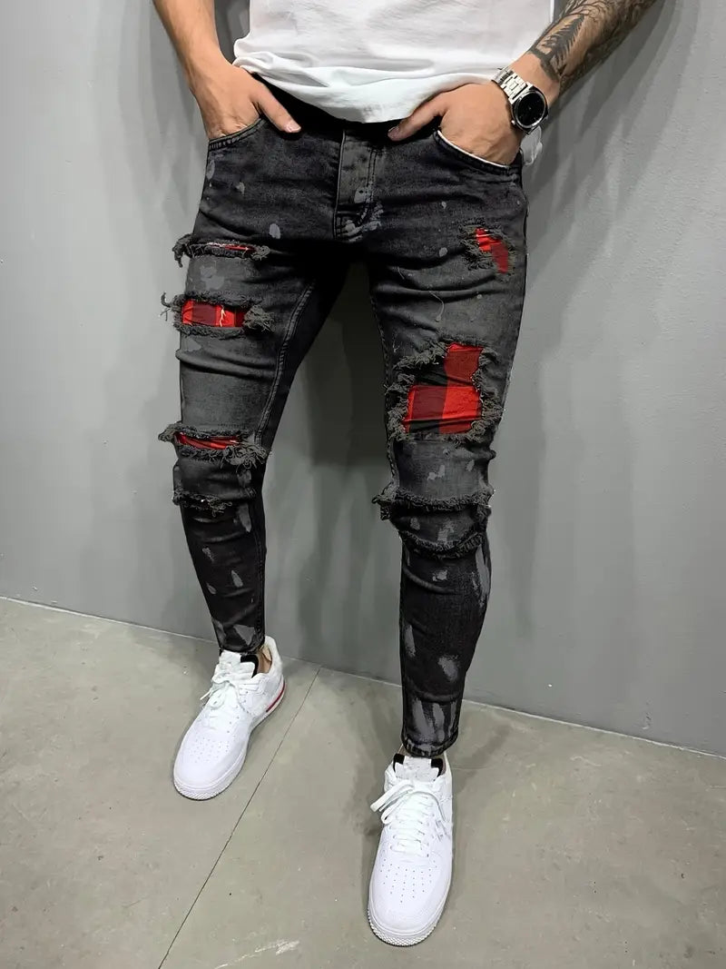 Men's distressed tapered denim jeans, perfect for urban street style. Features a modern fit and unique rips.
