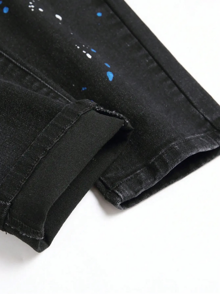Stylish men's distressed tapered denim jeans, featuring a comfortable stretch, ripped details, and urban street style.