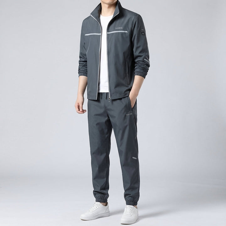 Men's Douglas sportswear two-piece training set, zippered top with matching pants, designed for performance.