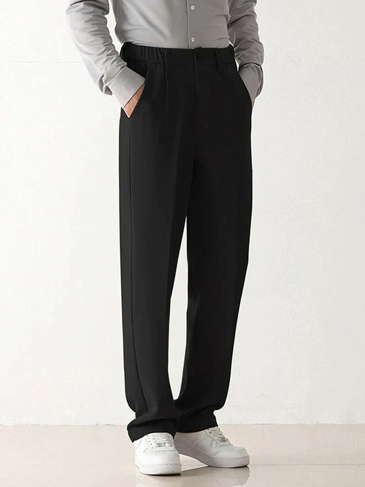 Back view of elegant men's draped formal trousers. Stylish dress pants suitable for professional and casual wear.