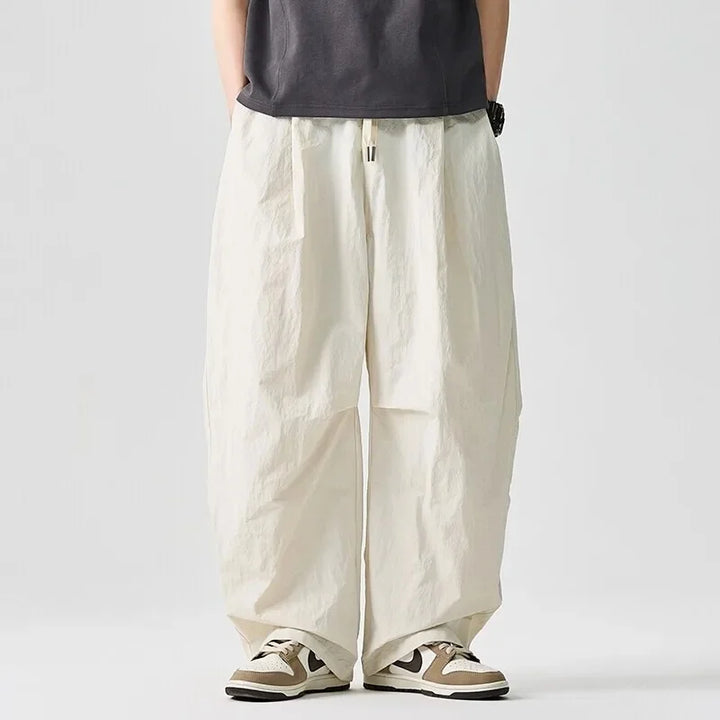 Modern men's Driftline streetwear pants. Relaxed fit and drawstring waist for a stylish, comfortable look.