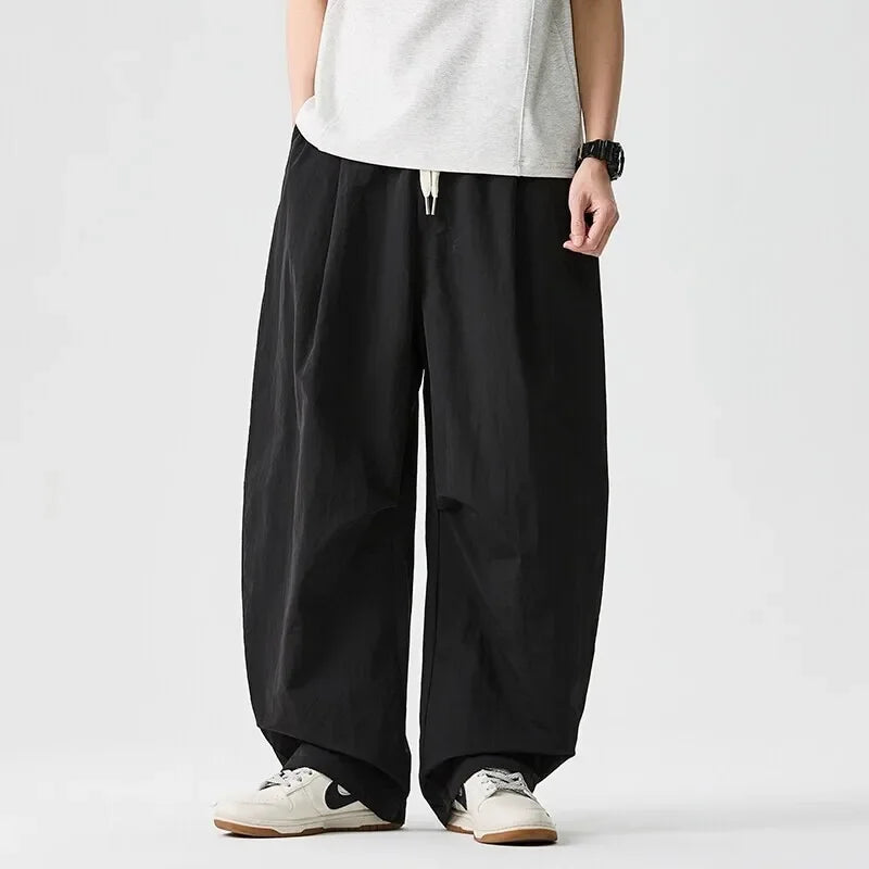 Driftline men's casual pants with a relaxed, baggy fit. Comfortable drawstring design for everyday wear.