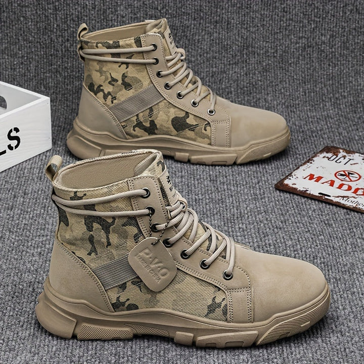 Pair of men's durable all-terrain black tactical boots, perfect for outdoor, hiking, and work boot needs.