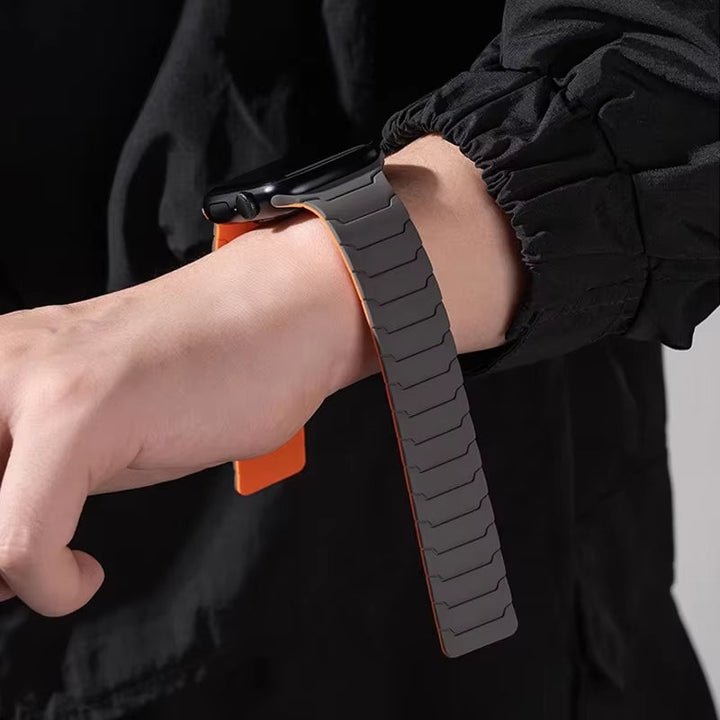 Men's black Apple Watch silicone strap, durable & sweat-resistant, with a strong magnetic closure.