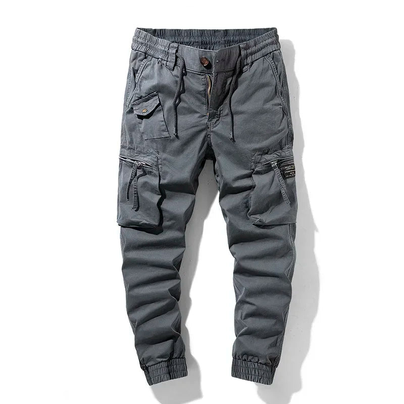 Gray men's comfortable utility jogger pants for activewear. Versatile, durable design for tactical and casual everyday use.