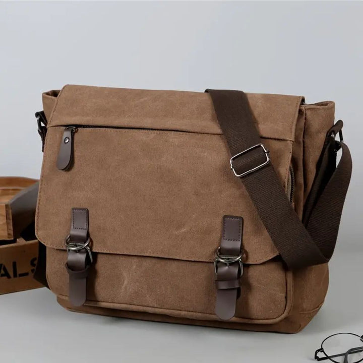 Men's canvas messenger bag, a durable, stylish satchel with vintage appeal for work & travel.