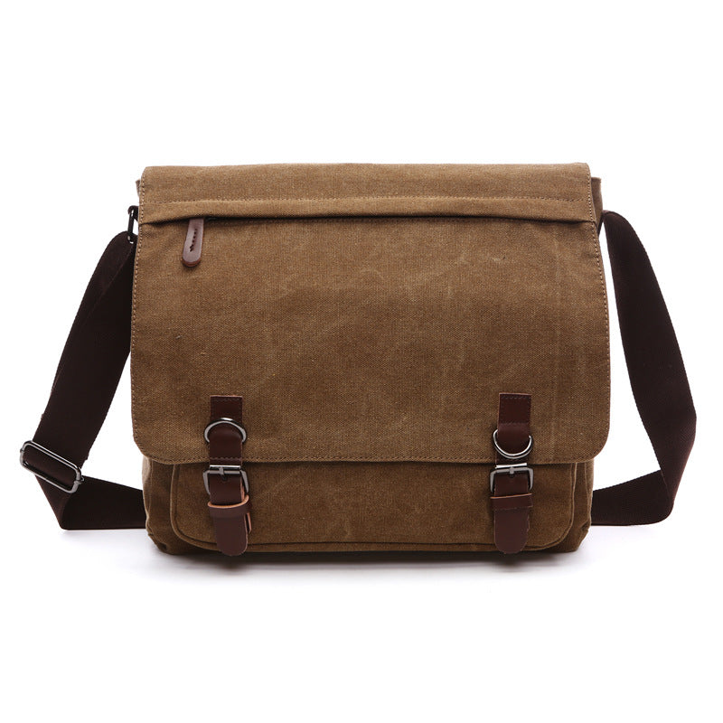 Classic men's canvas shoulder bag with secure buckle straps. Great for work, travel, or everyday carry.