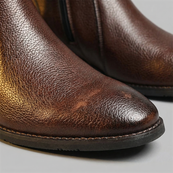 Men's durable work boots: black full-grain leather ankle design for tough jobs & all-day support.