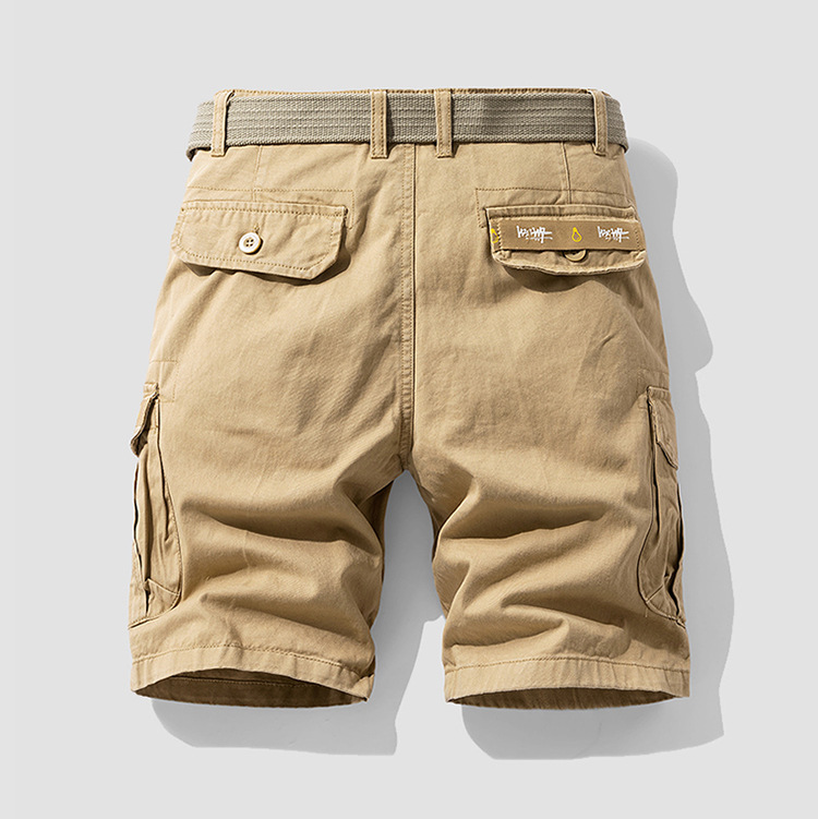 Rugged green men's cargo shorts with utility pockets, ideal for hiking, travel & everyday comfort.
