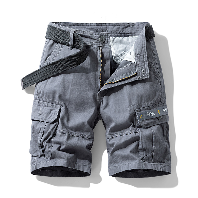 Close-up of deep utility pockets on men's cargo shorts, highlighting ample storage for adventure essentials.