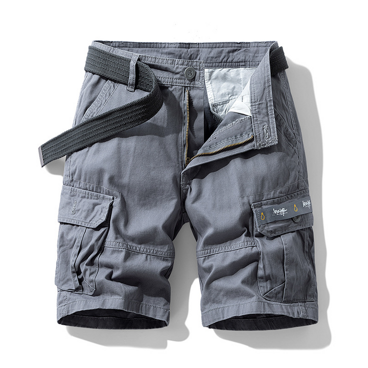 Close-up of deep utility pockets on men's cargo shorts, highlighting ample storage for adventure essentials.