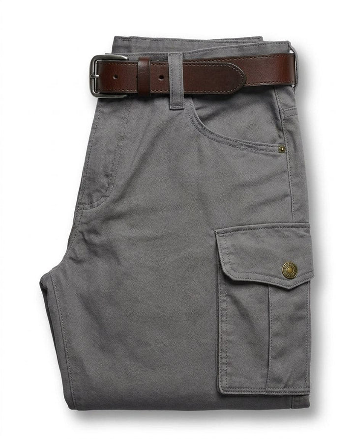 Rugged men's leather cargo pants, heavy-duty design for durability, suitable for workwear & outdoor gear.