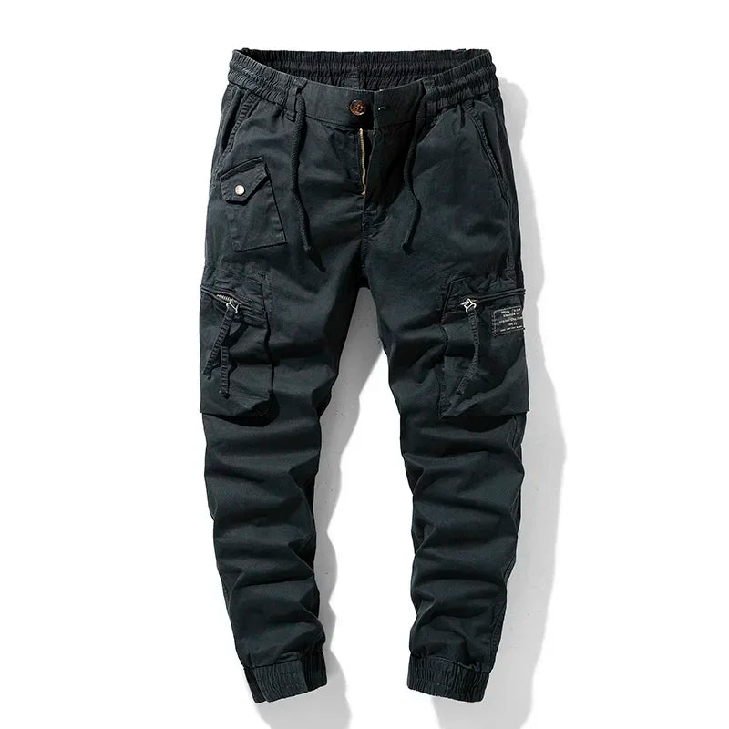 Men's utility cargo pants with multiple pockets, perfect for tactical use or workwear. Rugged design.