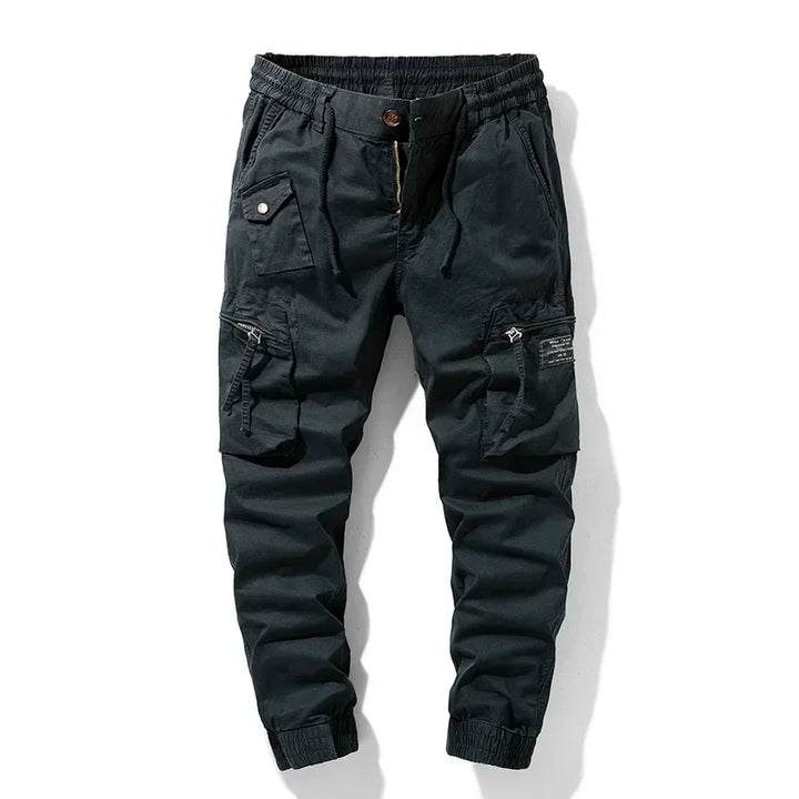 Men's utility cargo pants with multiple pockets, perfect for tactical use or workwear. Rugged design.