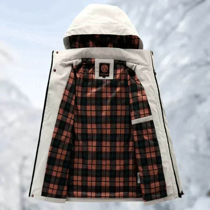 Man hiking in a rugged, wind-resistant men's all-season outdoor jacket, ideal for durable weather protection.