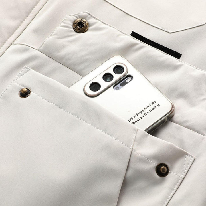 Close-up of men's durable all-weather outdoor jacket fabric, windproof & water-resistant for ultimate protection.