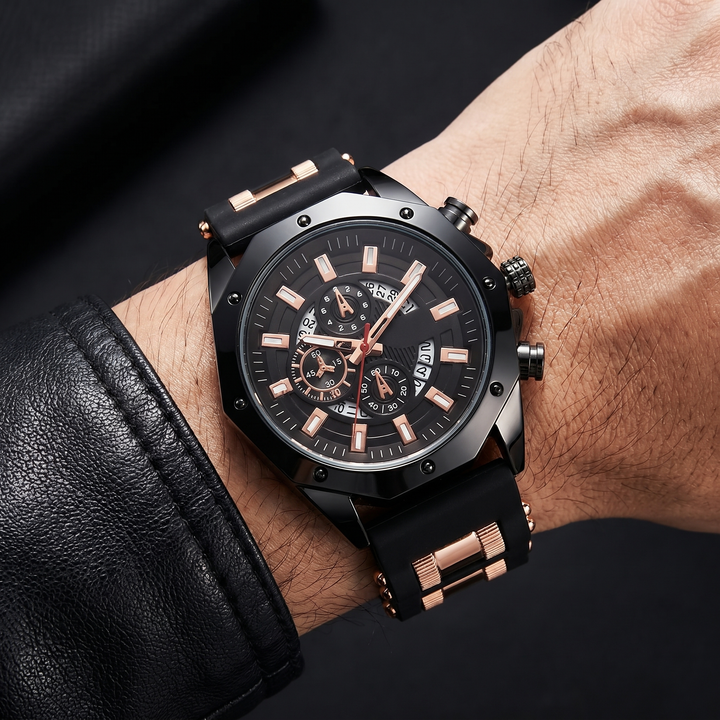 Grey stainless steel men's watch, black silicone strap, rectangular markers. Durable classic fashion.