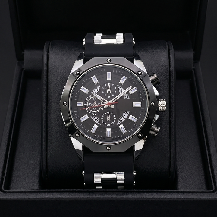 Close-up of men's black gold stainless steel watch dial with rectangular markers & sapphire crystal.