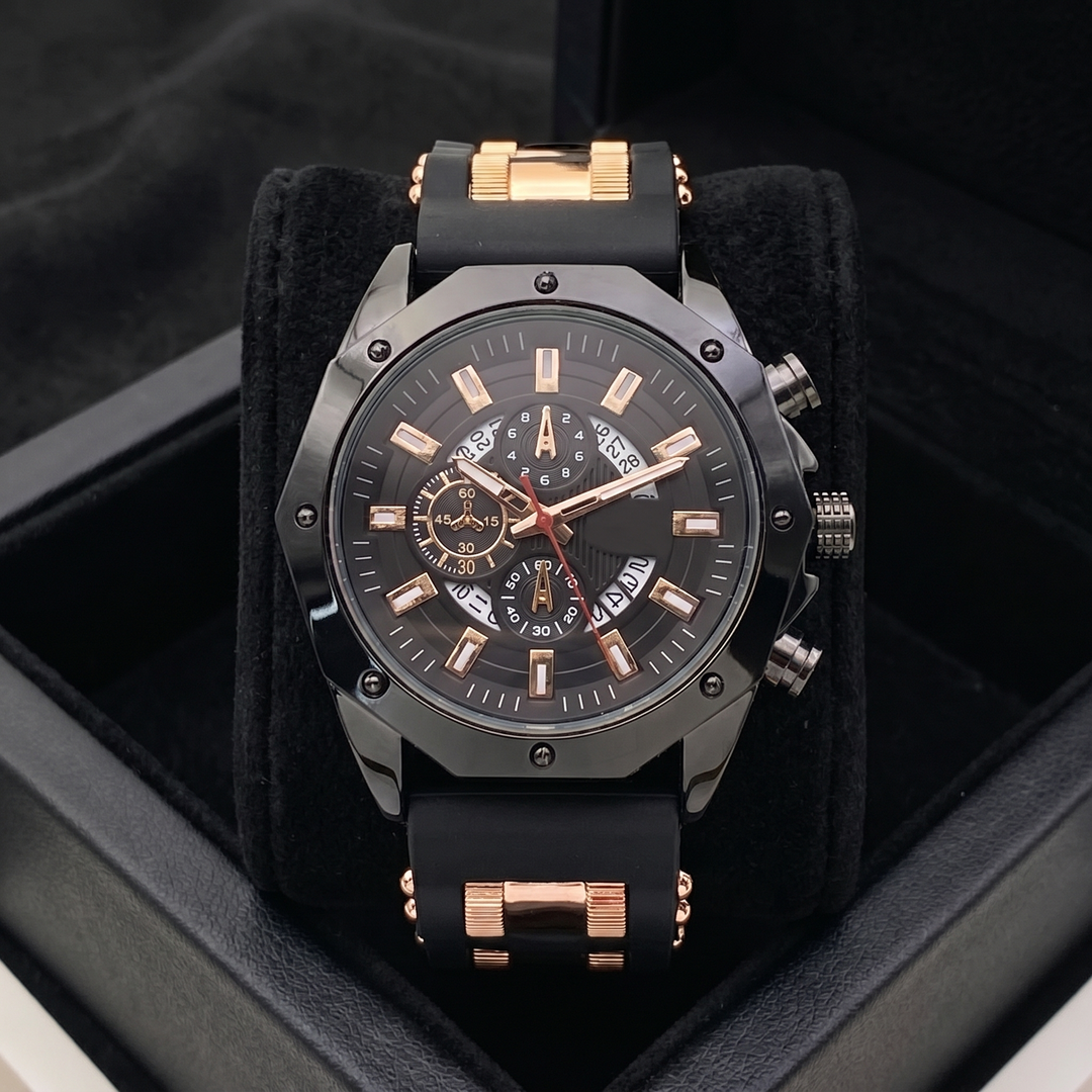 Men's durable stainless steel watch with black silicone strap worn on wrist. Sport & classic watch.