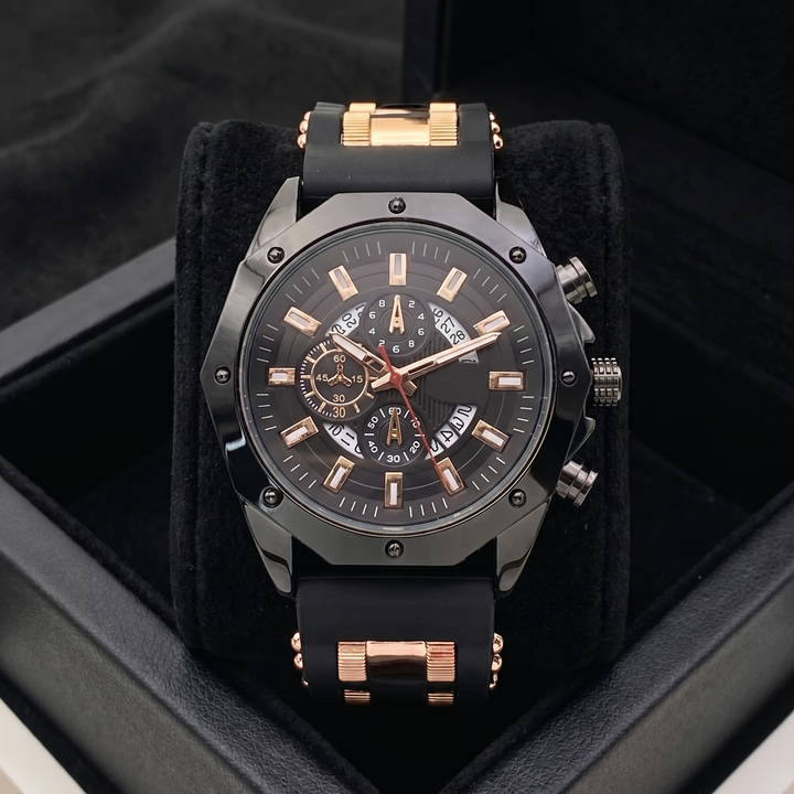 Men's durable stainless steel watch with black silicone strap worn on wrist. Sport & classic watch.